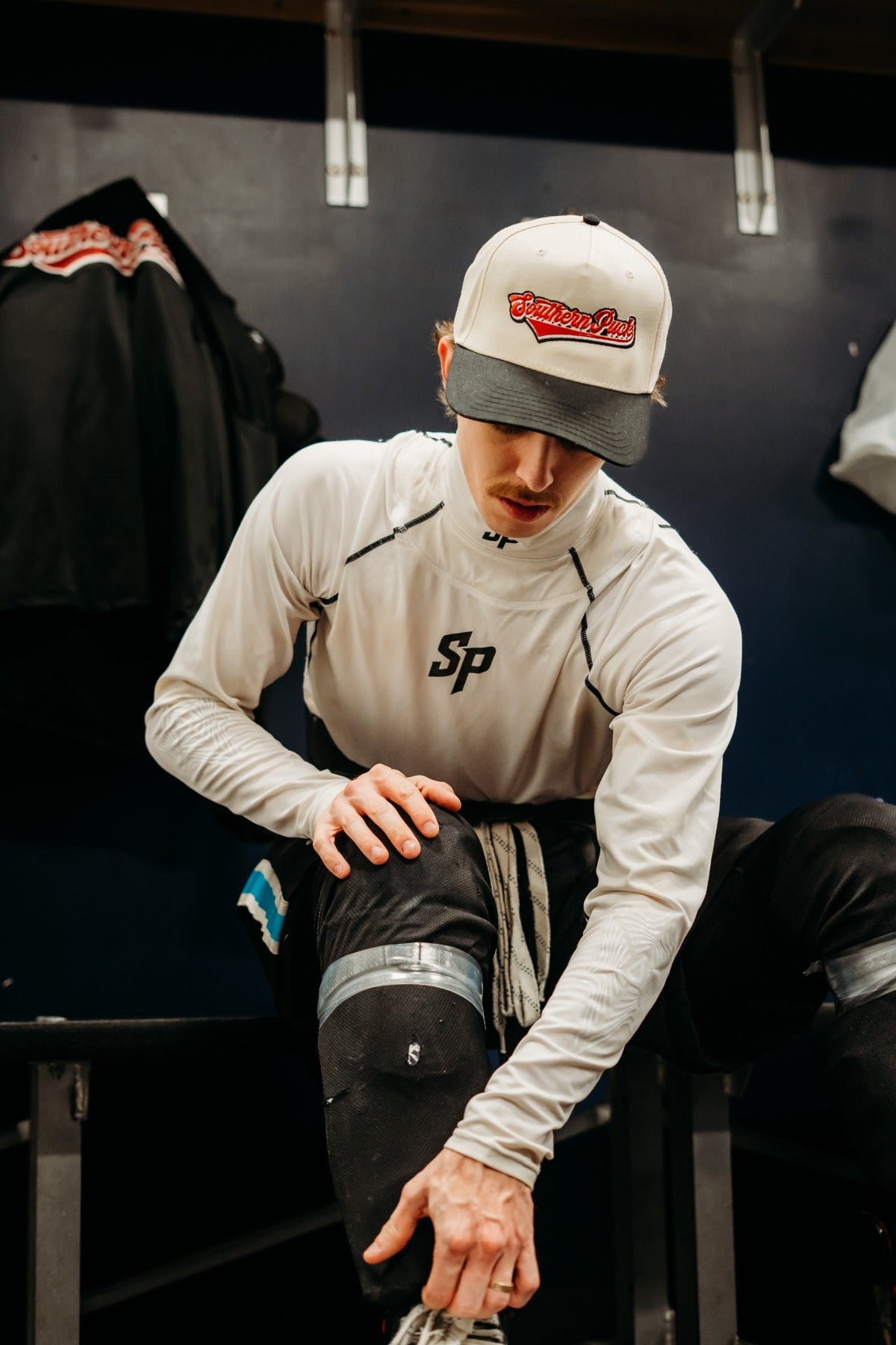Southern Puck neck guard shirt sleeves showing textured elbow-grip fabric
